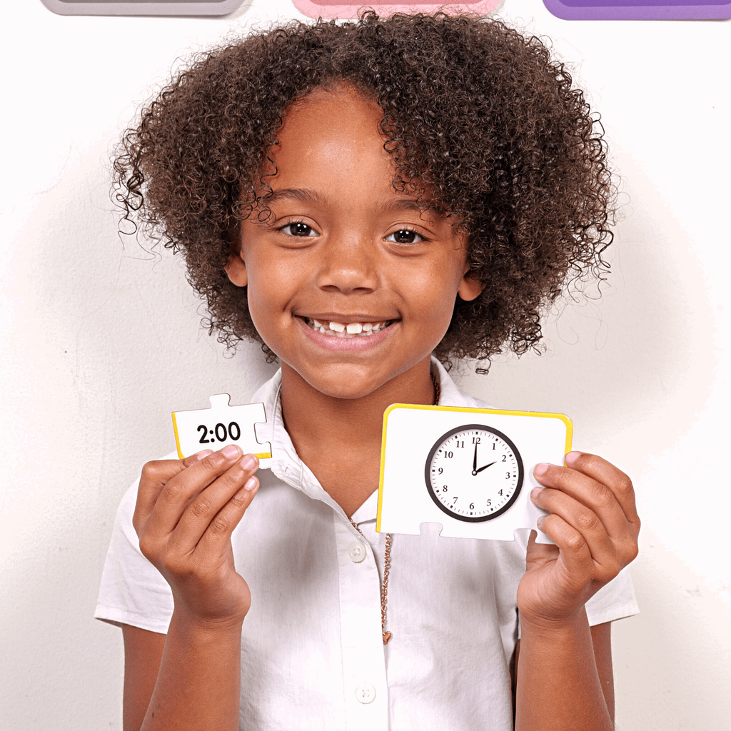 Black student playing first grade time games - learning to tell time on analog clock and digital clock with ABSee Me Time Puzzles
