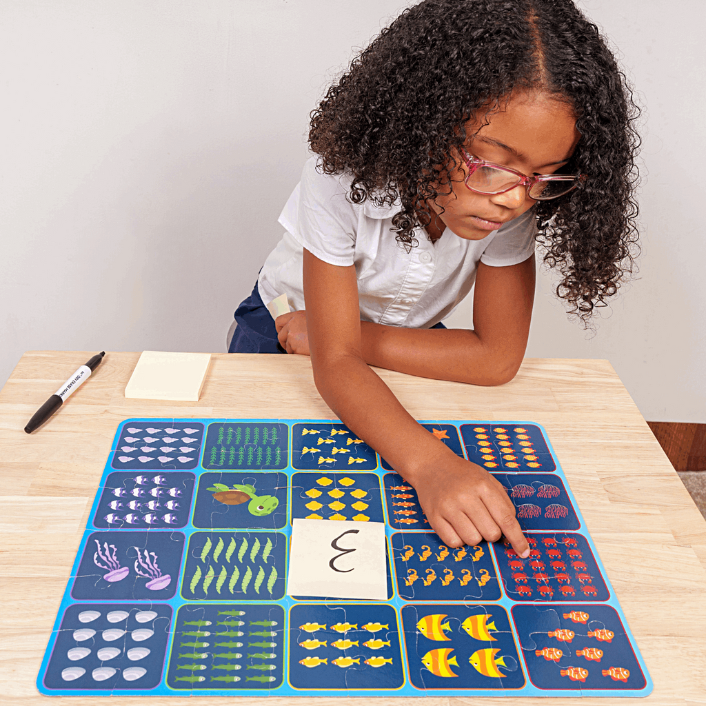 Black Student Completing Kindergarten Math Counting Activity Using ABSee Me Mermaid Find & Count Puzzle - Multicultural Education Math Activities