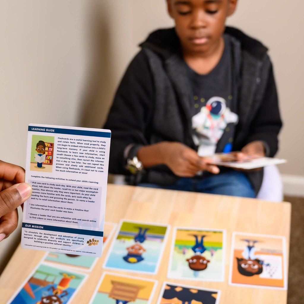 Culturally responsive teaching at home: A Black father facilitating a discussion with his black child about African American history figures like Martin Luther King and Harriet Tubman using ABSee Me's Legendary Leaders - Black History Flash cards.